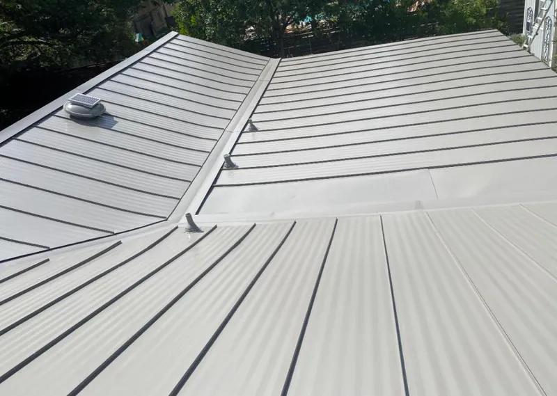 Solar attic fan installed on a metal roof for Roof Ventilation in Caribou